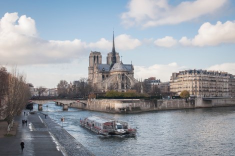 Crossing the bridge to Ile-Saint-Louis, catching the Bateaux Mouches and the Notre Dame in the background...